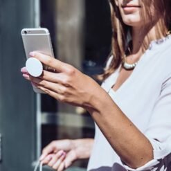 women with mobile and popsocket mobile holder