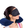 Girl wear inflatable travel neck pillow, eye shade mask and ear plugs