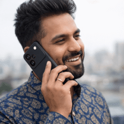 A person is on call by using Hooxar silicone mobile back cover for Realme P4 Pro 5G model mobile